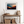 Framed wall art of layered mountains in twilight tones. Deep blues and sienna hues bring bold calm.