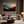 Framed wall art of layered mountains in twilight tones. Deep blues and sienna hues bring bold calm.