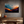 Framed wall art of layered mountains in twilight tones. Deep blues and sienna hues bring bold calm.
