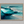Framed wall art of abstract ocean waves in deep indigo, teal, and white. A calming coastal piece that’s ready to hang.