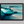 Framed wall art of abstract ocean waves in deep indigo, teal, and white. A calming coastal piece that’s ready to hang.