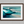Framed wall art of abstract ocean waves in deep indigo, teal, and white. A calming coastal piece that’s ready to hang.