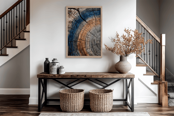 Framed fine art print of tree ring textures in warm browns and cool blues. A striking, timeless piece of nature-inspired wall art.