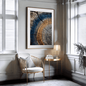 Framed fine art print of tree ring textures in warm browns and cool blues. A striking, timeless piece of nature-inspired wall art.