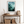 Framed wall art of a mystical mountain scene in emerald and teal hues. A tranquil, enchanting landscape print. Ready to hang.