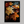 Framed wall art of crimson, amber, and sienna maple leaves with glistening droplets. A radiant autumn foliage print. Ready to hang.