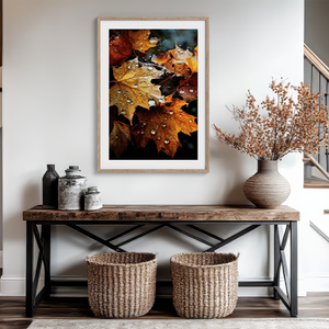 Framed wall art of crimson, amber, and sienna maple leaves with glistening droplets. A radiant autumn foliage print. Ready to hang.