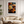 Framed wall art of crimson, amber, and sienna maple leaves with glistening droplets. A radiant autumn foliage print. Ready to hang.