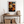 Framed wall art of crimson, amber, and sienna maple leaves with glistening droplets. A radiant autumn foliage print. Ready to hang.
