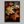Framed wall art of crimson, amber, and sienna maple leaves with glistening droplets. A radiant autumn foliage print. Ready to hang.