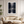 Framed wall art of a misty evergreen forest reflected on still waters. A serene, ethereal woodland print. Ready to hang.