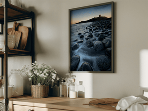 Dunstanburgh Castle sunrise wall art styled in a calm neutral interior