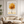 Framed wall art of a golden autumn tree in a minimalist cubist style. Soft, serene, and ready to hang.