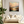 Framed wall art of a golden lake and hills at dusk. A tranquil painterly landscape print that brings warmth and peace. Ready to hang.