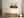 Geometric summer landscape wall art styled in a calm neutral interior