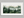 Greenwood Haze – Misty Forest Wall Art Print in a white frame with a mount