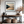 Framed wall art of a misty morning river winding through soft-hued mountains. A tranquil landscape print. Ready to hang.