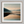 Framed wall art of a misty morning river winding through soft-hued mountains. A tranquil landscape print. Ready to hang.