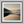 Framed wall art of a misty morning river winding through soft-hued mountains. A tranquil landscape print. Ready to hang.