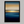 Framed wall art of an ocean sunset in coral, peach, and blue tones. A timeless abstract seascape print. Ready to hang.