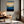 Framed wall art of an ocean sunset in coral, peach, and blue tones. A timeless abstract seascape print. Ready to hang.