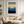 Framed wall art of an ocean sunset in coral, peach, and blue tones. A timeless abstract seascape print. Ready to hang.