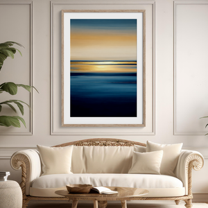 Framed wall art of an ocean sunset in coral, peach, and blue tones. A timeless abstract seascape print. Ready to hang.