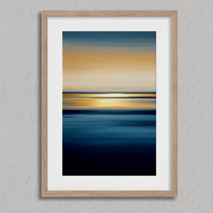 Framed wall art of an ocean sunset in coral, peach, and blue tones. A timeless abstract seascape print. Ready to hang.
