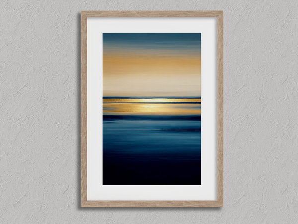 Framed wall art of an ocean sunset in coral, peach, and blue tones. A timeless abstract seascape print. Ready to hang.