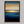 Framed wall art of an ocean sunset in coral, peach, and blue tones. A timeless abstract seascape print. Ready to hang.