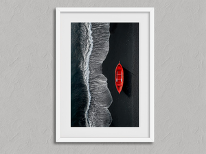 Red Shoreline – Red Boat Coastal Wall Art Print in a white frame with a mount