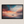 Framed canvas wall art of a glowing sunset and solitary boat. A calm seascape in warm hues, ready to hang.