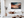 Sunset boat seascape canvas wall art styled in a calm coastal interior