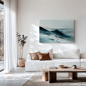 Framed snowy mountain canvas wall art styled in a calm neutral interior