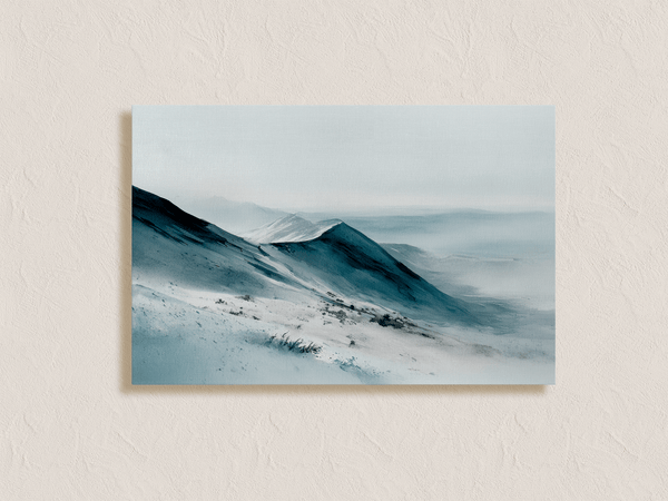 Framed canvas wall art of snowy peaks in soft watercolour blues and greys. A calm, minimalist mountain print. Ready to hang.