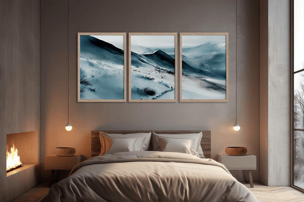 Watercolor mountain triptych wall art above bed
