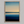 Framed wall art of a minimalist ocean horizon in pale blues and pastels. A serene abstract seascape print. Ready to hang.