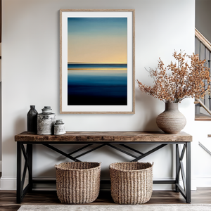 Framed wall art of a minimalist ocean horizon in pale blues and pastels. A serene abstract seascape print. Ready to hang.