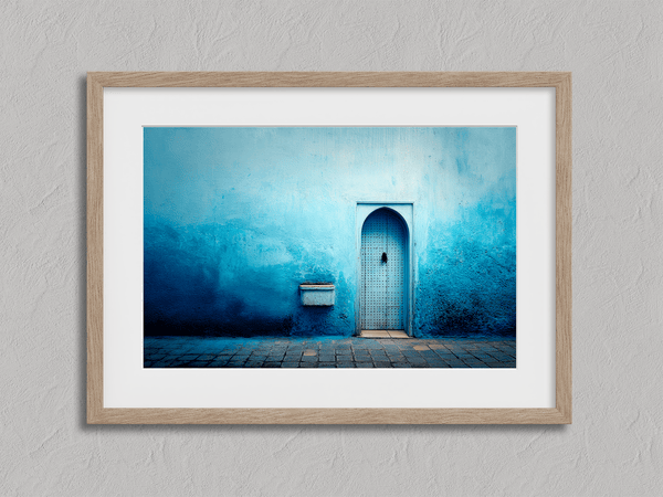 Framed fine art print of a Moroccan blue doorway. Minimalist travel-inspired wall art full of calm, texture, and timeless charm.