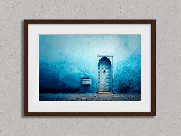 Framed fine art print of a Moroccan blue doorway. Minimalist travel-inspired wall art full of calm, texture, and timeless charm.