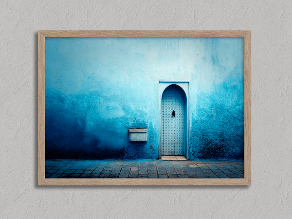 Framed fine art print of a Moroccan blue doorway. Minimalist travel-inspired wall art full of calm, texture, and timeless charm.