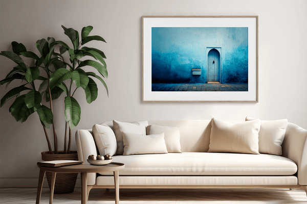Framed fine art print of a Moroccan blue doorway. Minimalist travel-inspired wall art full of calm, texture, and timeless charm.