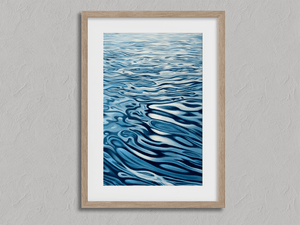 Framed abstract ocean wall art print with flowing blue reflections