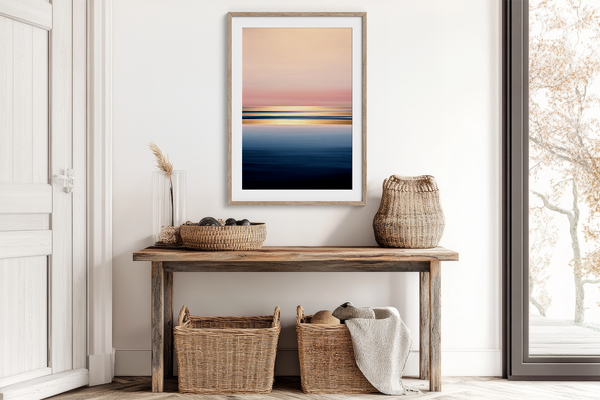 Framed wall art of a soft watercolour ocean sunrise in pastel tones. A calm, minimalist seascape print. Ready to hang.