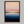 Framed wall art of a soft watercolour ocean sunrise in pastel tones. A calm, minimalist seascape print. Ready to hang.