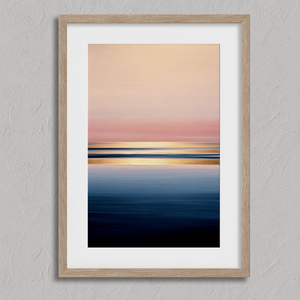 Framed wall art of a soft watercolour ocean sunrise in pastel tones. A calm, minimalist seascape print. Ready to hang.