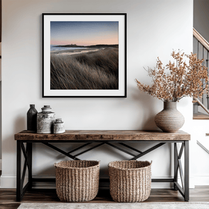 Serene Northumberland Castle at sunset with seagrass and tidal reflections — a tranquil wall art print for peaceful, coastal-inspired interiors.