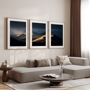 Discover Twilight Mirage, a panoramic desert dunes wall art print bathed in twilight glow with warm ambers and dusky blues.