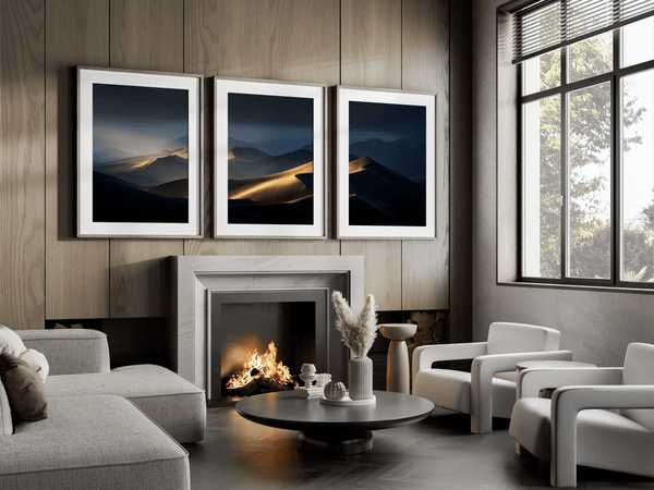 Discover Twilight Mirage, a panoramic desert dunes wall art print bathed in twilight glow with warm ambers and dusky blues.