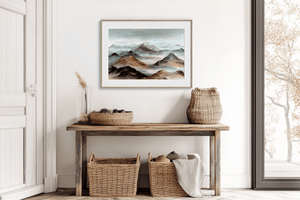 Watercolour mountain wall art styled in a calm neutral interior